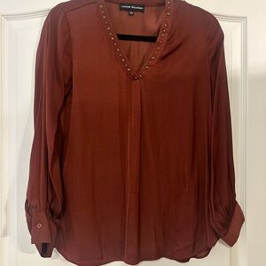 Rust colored blouse with brass studs on collar size small